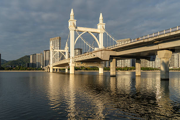 istock Riverside city buildings and a European-style cable-stayed bridge 2252623284