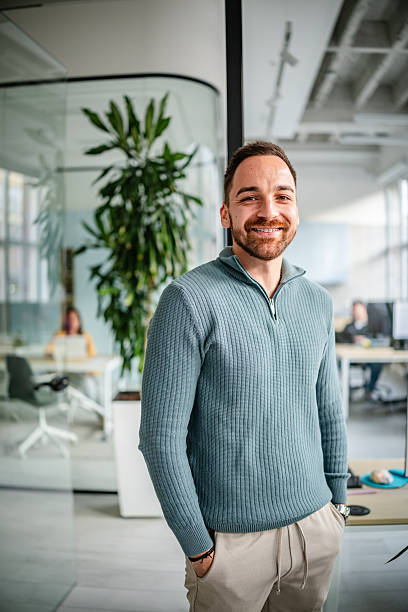 istock Professional adult working in a modern office setting with colleagues engaged in tasks during office hours 2252624468
