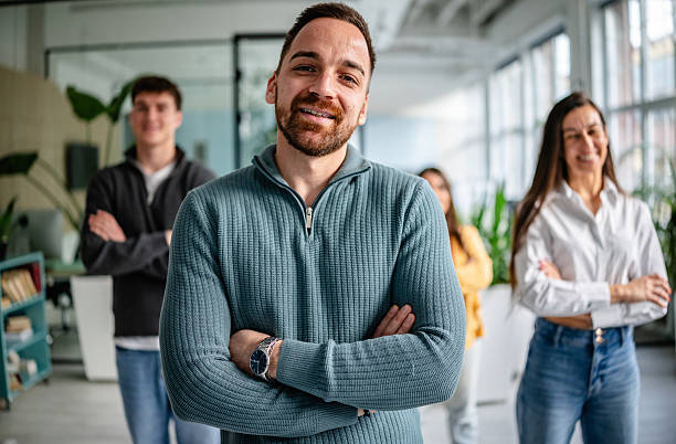 istock Team members engage in collaborative efforts in a modern office setting while focusing on their professional tasks 2252626324