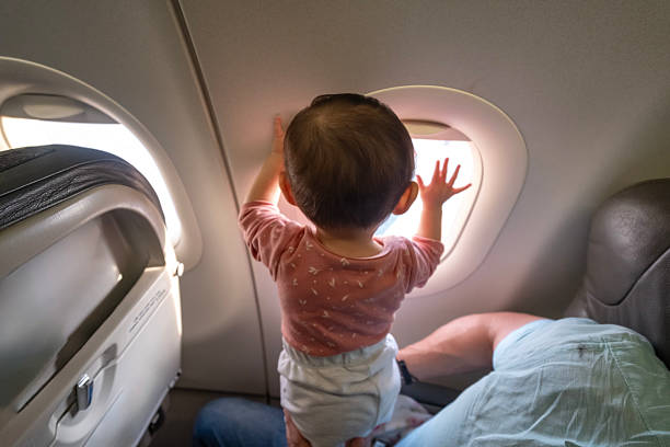 istock father travelling by aeroplane with his baby 2252626895