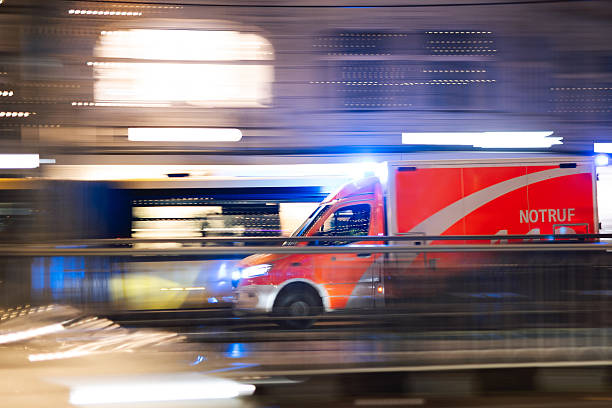 istock Emergency Vehicle In Motion With Blue Lights At Night 2252627790