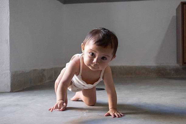 baby playing and crawling on the floor