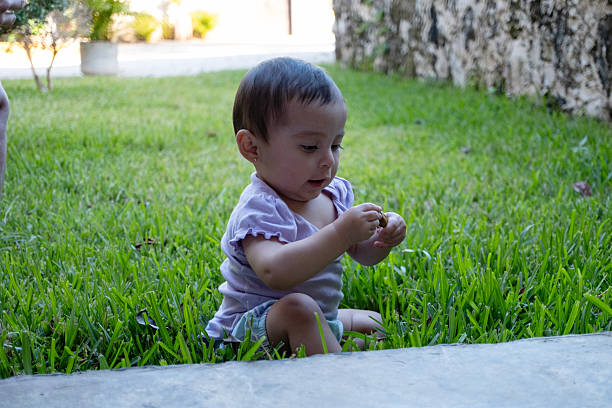 baby playing in the garden