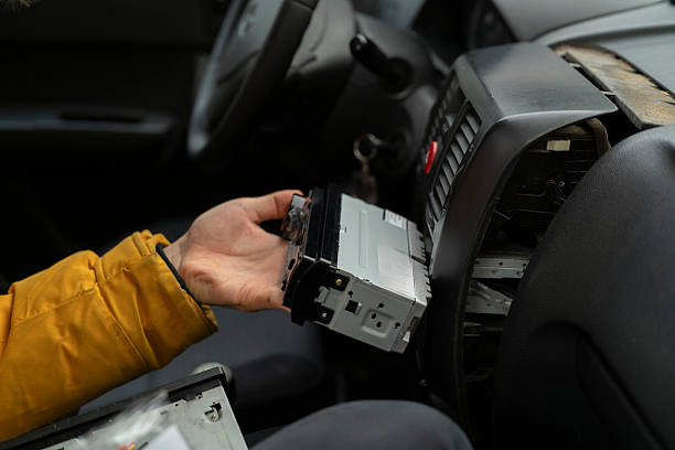 istock A person is removing a car audio device from the dashboard 2252633352