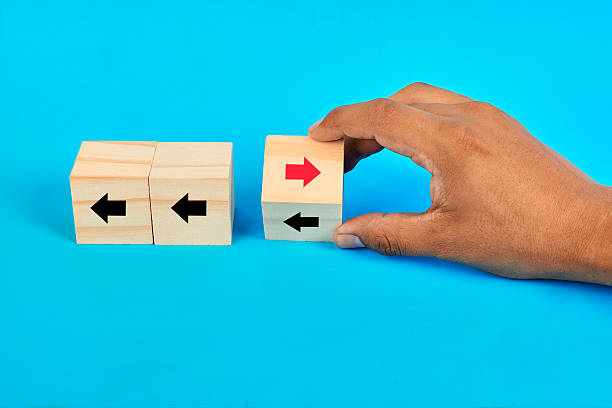 istock A decision contrast cubes concept featuring a hand selecting a divergent direction to illustrate alternative thinking and strategic differentiation. 2252638915