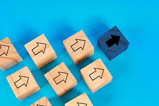 istock A standout leadership concept showing one forward moving block distinct from many similar ones symbolizing direction influence and strategic guidance. 2252638995