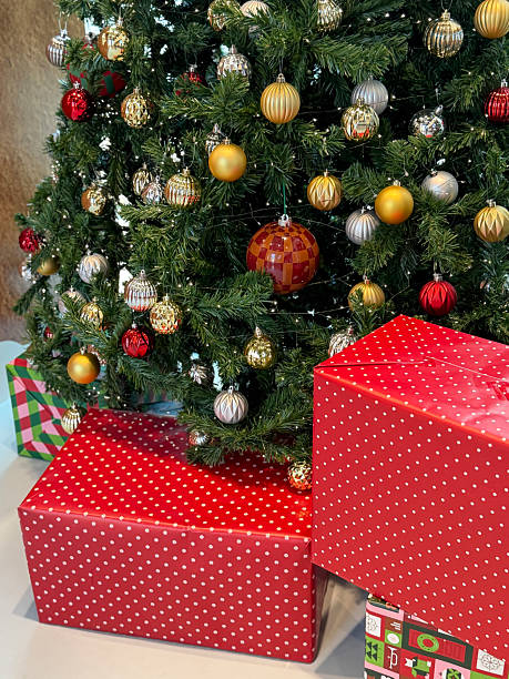 istock Image of christmas tree with presents and gifts, featuring festive gift wrapping, decorative bows, ribbons, and baubles 2252641192