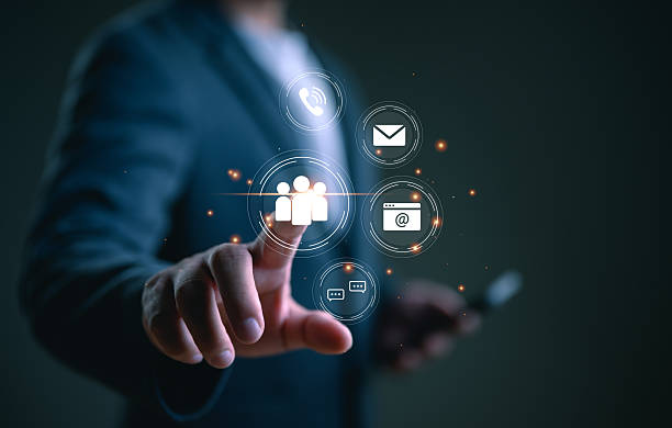 istock Contact us or Customer support hotline, people connect. Businessman using smartphone and touching on virtual screen contact icons (email, address, live chat, telephone, customer service). 2252641242