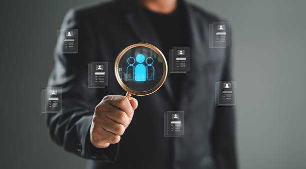 istock HRM, Human Resource Management, man use magnifier for search manager icon which is among staff icons for human development recruitment leadership and customer target group concept. 2252641435