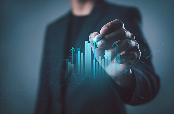istock Businessman analyzing digital bar chart with rising arrows, symbolizing growth, financial success, data analytics, investment, progress, strategy, innovation, and corporate development. 2252642758