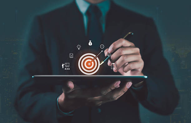 istock Businessman using digital tablet with target icon, symbolizing goal setting, business strategy, planning, focus, achievement, marketing, success, and professional growth in modern corporate concept. 2252642835