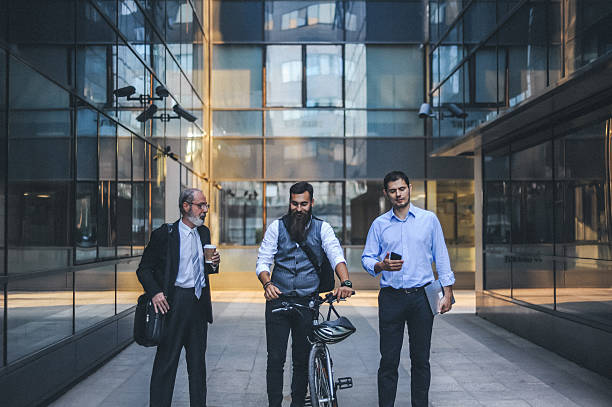 istock Business professionals with bicycle in urban setting 2252645144