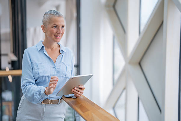 istock Businesswoman using digital tablet in modern office 2252645239