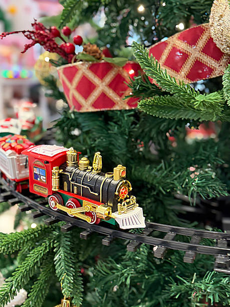 istock Image of festive christmas tree featuring model railway trains, toy decorations, and charming ornaments, creating joyful holiday atmosphere 2252646651