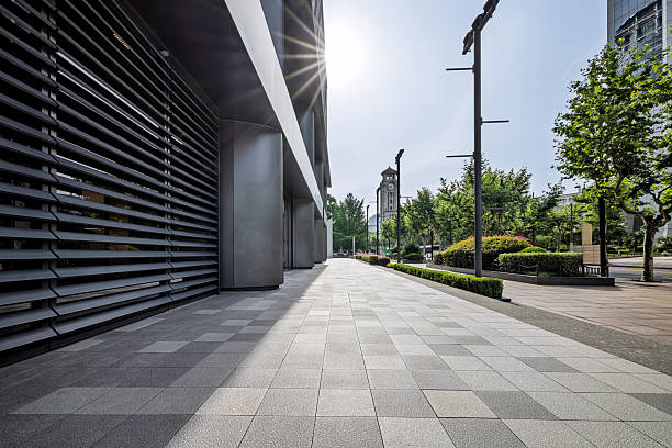 istock Empty square floor and modern building facade with bright sun in the city. 2252648474