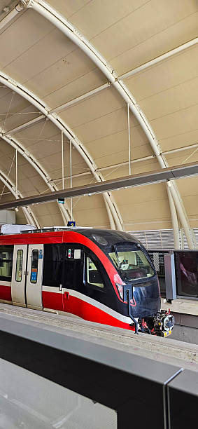 istock Light Rail Transit or LRT or rail transport system in Indonesia, modern metro train stationed at an urban platform, showcasing efficient public transport system 2252650874