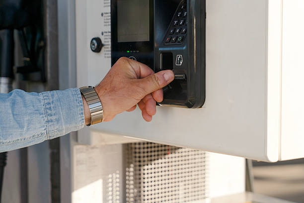 istock Man using card reader at payment terminal in convenience store during day for quick transaction at gas station near the highway 2252653939