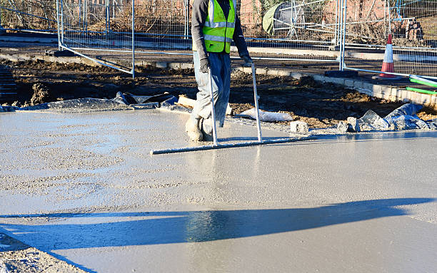 istock A construction worker uses screeding tool to level freshly poured concrete on  building site 2252655128