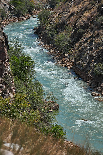 istock A Serene River Elegantly Flowing Through a Stunning Rocky Canyon Landscape 2252655387