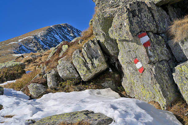 An Ice climber looking back along the ridge of the mountain he just conquered. Tottori, Japan. February 2016.