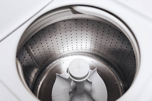istock Empty washing machine drum interior. Stainless steel washer inside view. Clean laundry appliance detail. Modern household equipment. 2252658646
