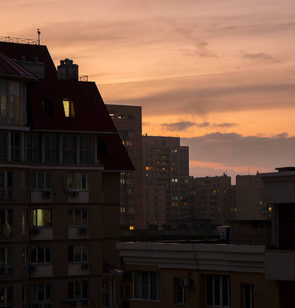istock Evening light casts a warm glow over urban buildings during sunset, creating a serene scene 2252662902