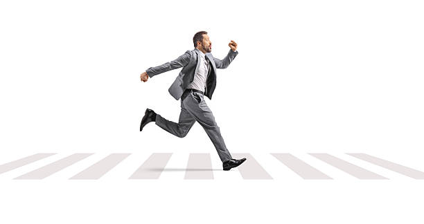 istock Businessman running fast over zebra crossing 2252666319