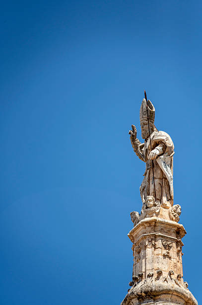 Ostuni, Apulia, Italy - June 27, 2025: Detail of the column of Saint Oronzo in the old town of Ostuni, one of the sights of the White City in Apulia.