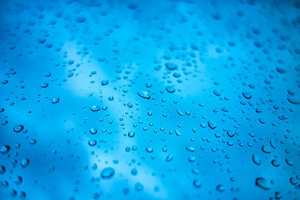 Background with water droplets on a window on a rainy day.