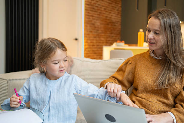 istock Mother daughter learning together with laptop at home 2252669218