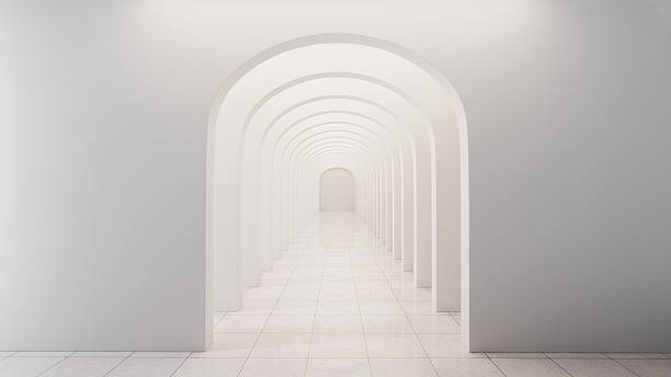 istock corridor stretches ahead with multiple arches on each side. walls and floor are white, creating a clean look. space has good lighting and minimal decoration 2252669451