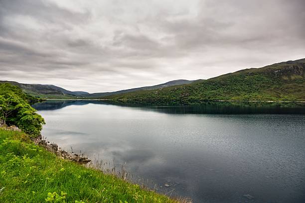 istock A scenic, tranquil view across a deep blue loch or mountain lake. 2252670471