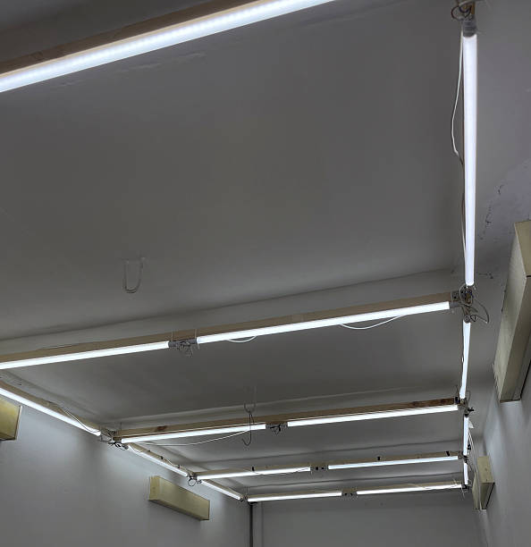 istock Bright, modern ceiling lights hang from the ceiling in a spacious indoor area 2252670591