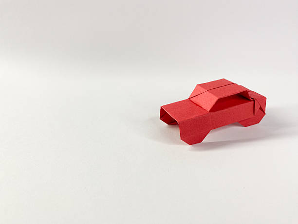 istock Red origami car 2252670695