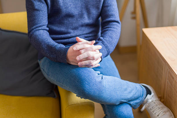 istock Man sitting on armchair with clasped hands 2252670809