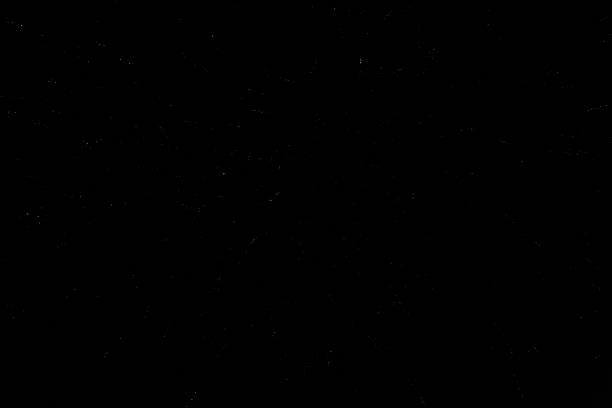 Firework display against black night sky with artistic noise and blur