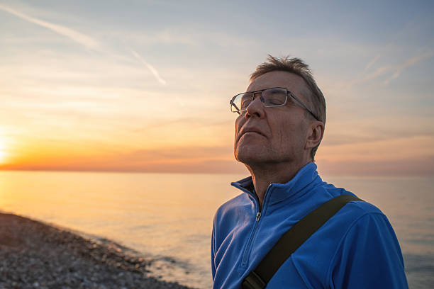 istock Senior man enjoying sunset on the beach 2252674301