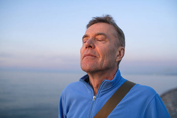 Senior man near the sea in the evening