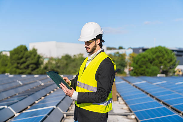 istock Engineer inspecting solar panels for renewable energy production 2252674397