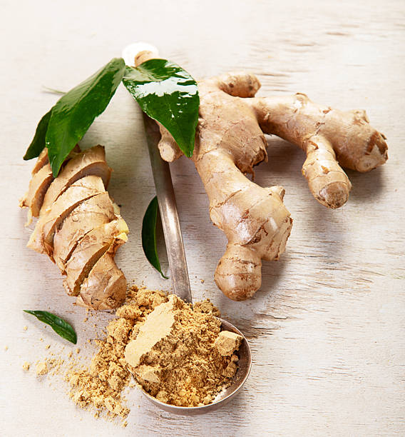 istock Fresh ginger with sliced and green leaves. 2252675635