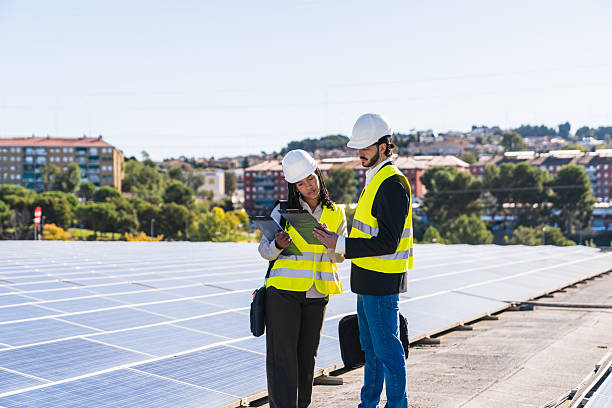 istock Engineers inspecting solar panels for sustainable energy generation 2252676972