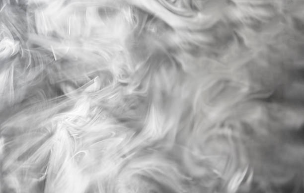 istock abstract background of white smoke on a black background. monochrome 2252677653