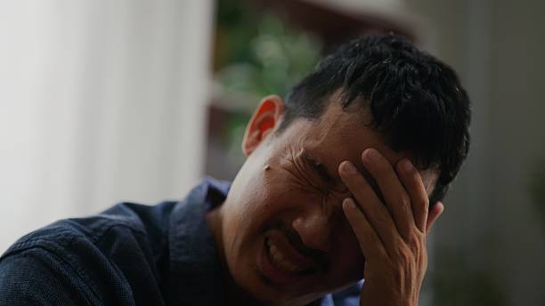 istock Asian Man Feeling Overwhelmed with Worry and Mental Pressure. 2252677799