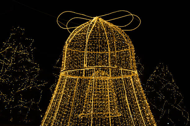Christmas light installation shaped like holiday ornaments at night