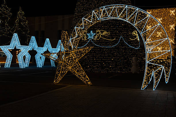 istock Christmas light installation shaped like holiday ornaments at night 2252678213