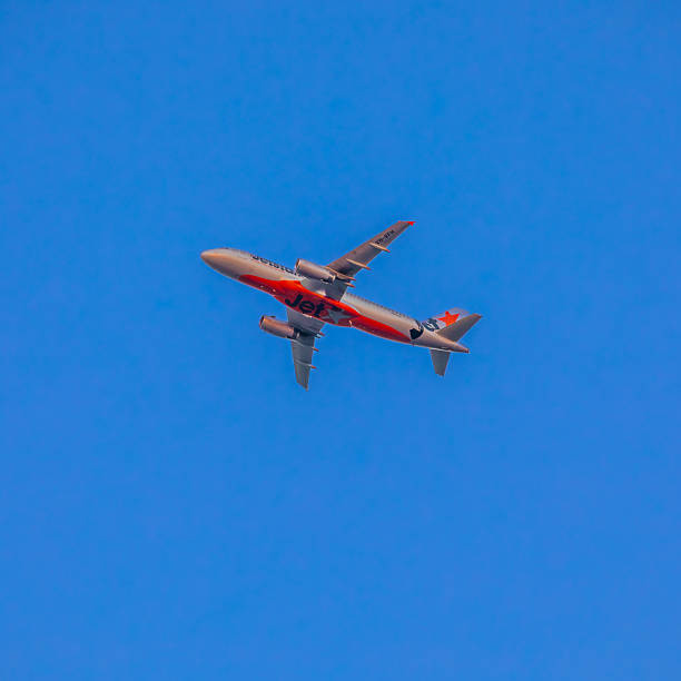18 December 2025 Plane in full flight on a clear blue sky over Sydney Australia