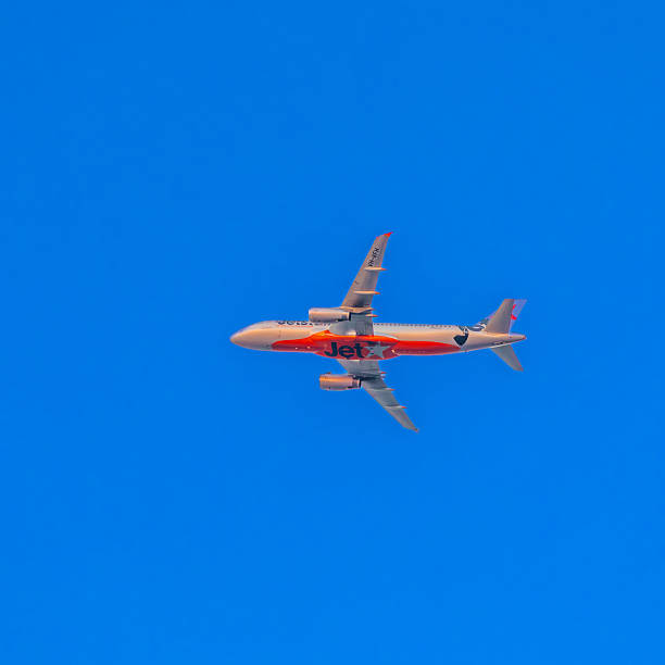 18 December 2025 Plane in full flight on a clear blue sky over Sydney Australia