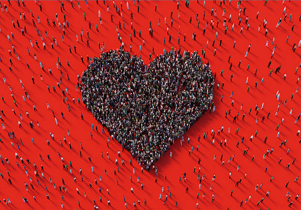 istock Human Crowd Forming A Heart Symbol On Red Background 2252678586