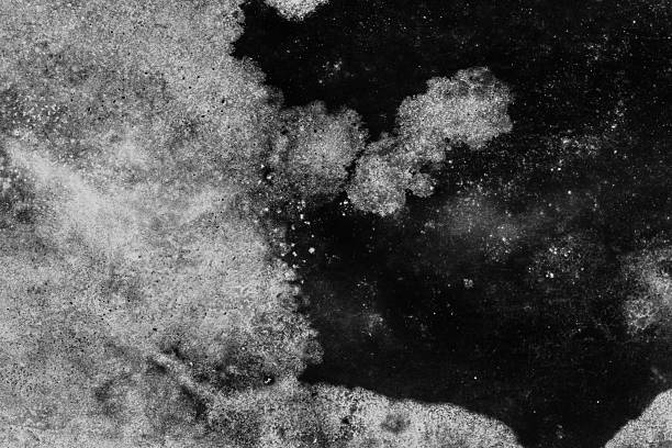 A weathered surface featuring irregular stains, smudges, and aged paint. Ideal for backgrounds, textures, and design concepts conveying age, decay, and mystery. Grunge Texture Design Element.