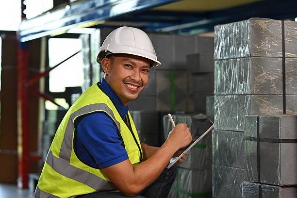 istock Happy warehouse employee working efficiently with tablet for stock management in an industrial storage setting 2252679964